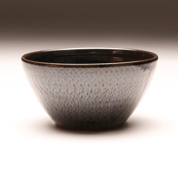 GH256  Medium bowl with Cosmic Blue & Red interior, over Black with chattering